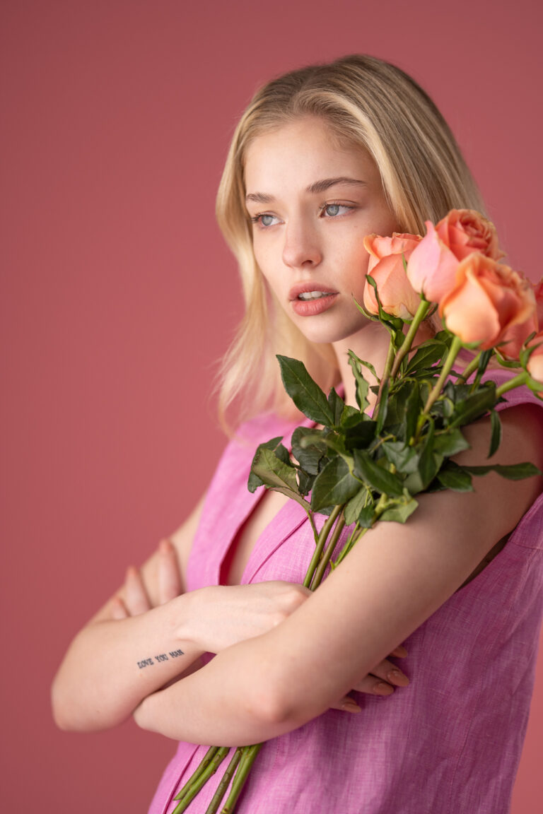 Model against a pink background