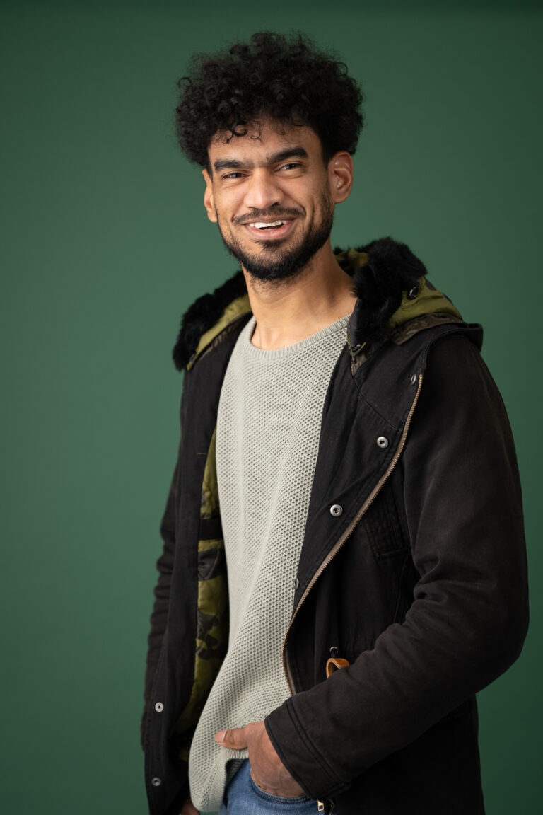 Portrait against a Deep Green Background